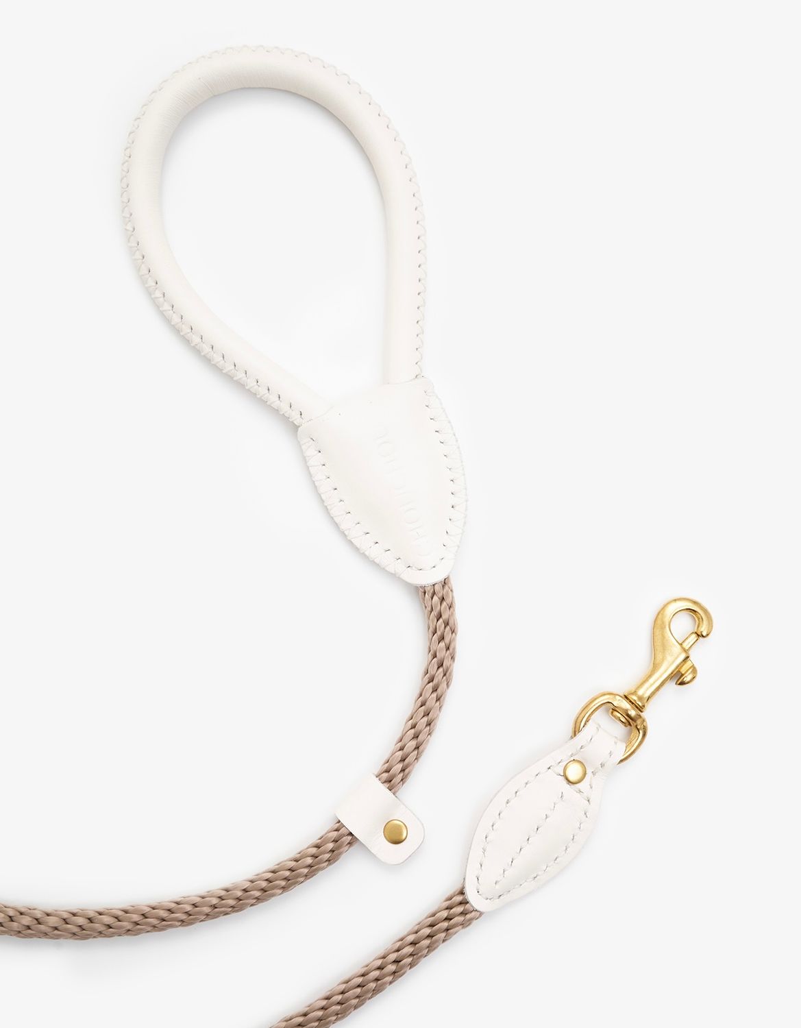 Side view of a designer milk leather dog leash with gold clasp and braided rope for added strength