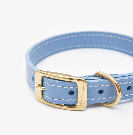 Closeup view of a luxury light blue leather dog collar with premium stitching and elegant design