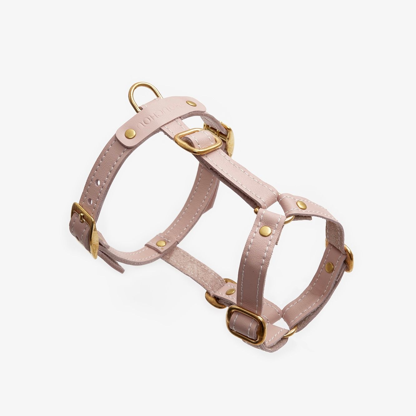 Premium pink dog harness made from high-quality leather with stylish hardware, offering freedom of movement