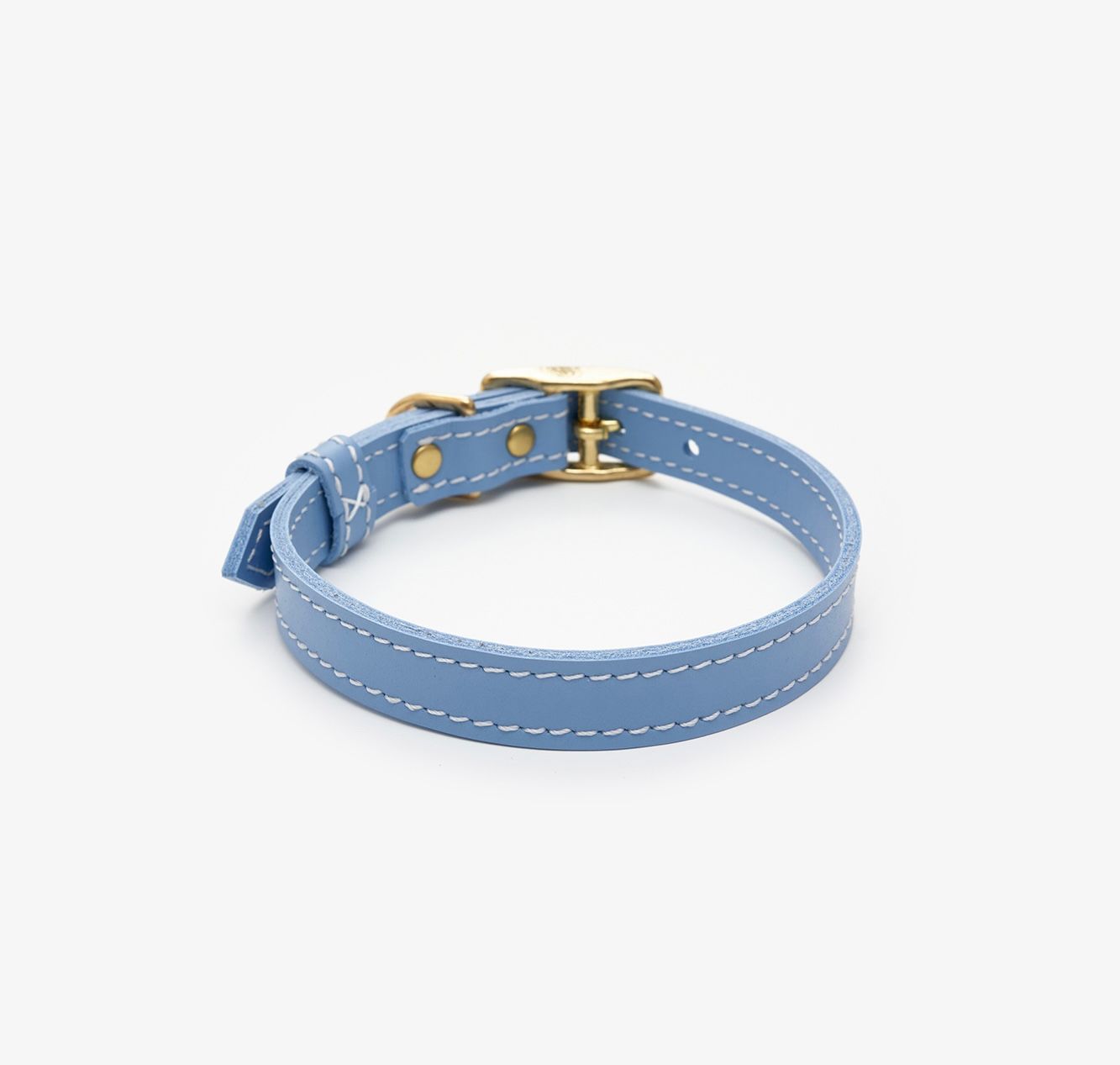 Side view of a premium light blue leather dog collar featuring a gold buckle for a touch of elegance