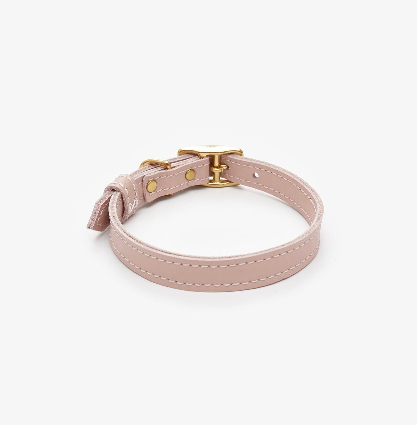 Side view of a premium pink leather dog collar featuring a gold buckle for a touch of elegance