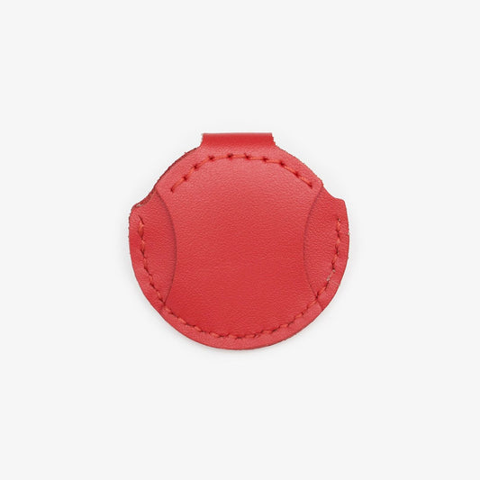 Red leather AirTag holder for cats with gold button, handmade from Italian leather on a white background