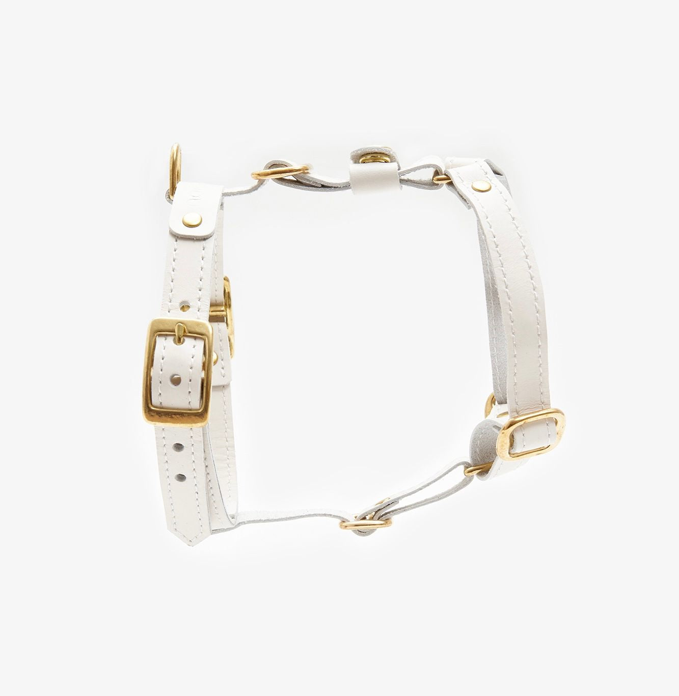 Side view of a designer milk-white leather dog harness featuring sleek lines, durable hardware, and a minimalist design