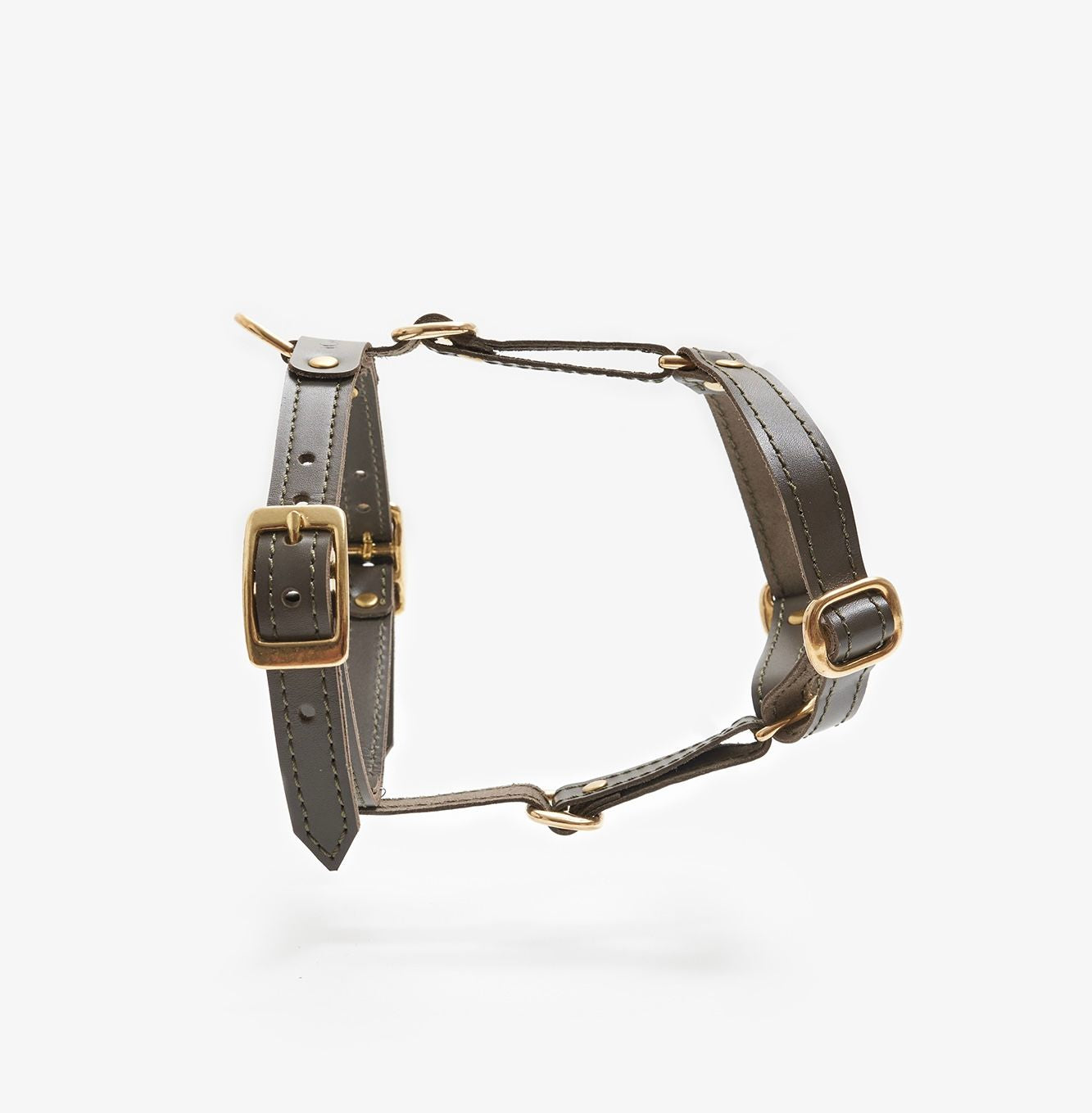 Side view of a designer olive leather dog harness featuring sleek lines, durable hardware, and a minimalist design