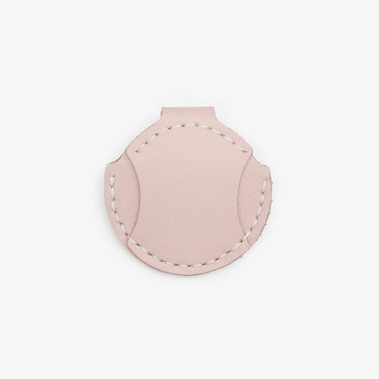 Pink leather AirTag holder for cats with gold button, handmade from Italian leather on a white background