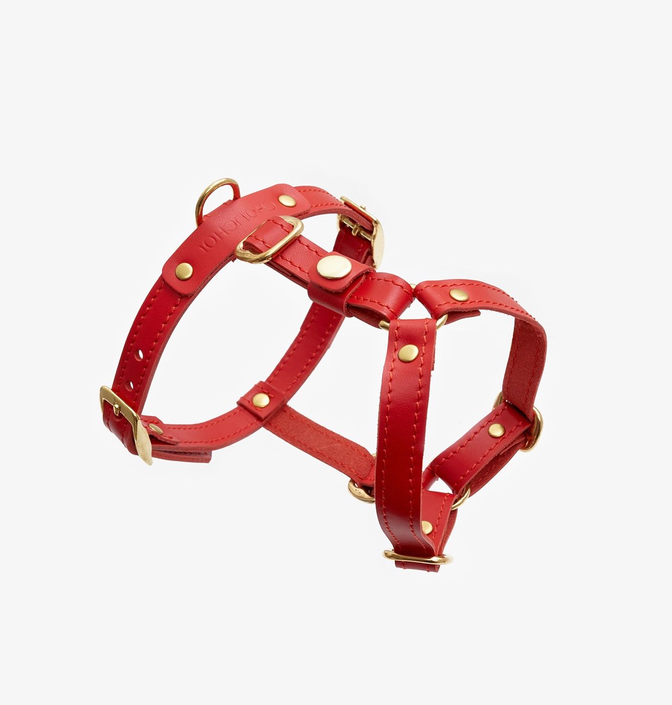 Premium red dog harness made from high-quality leather with stylish hardware, offering freedom of movement